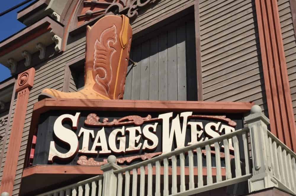 stages west exterior sign with a giant boot