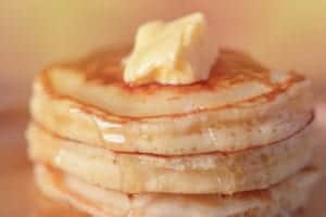 stack of pancakes with butter on top
